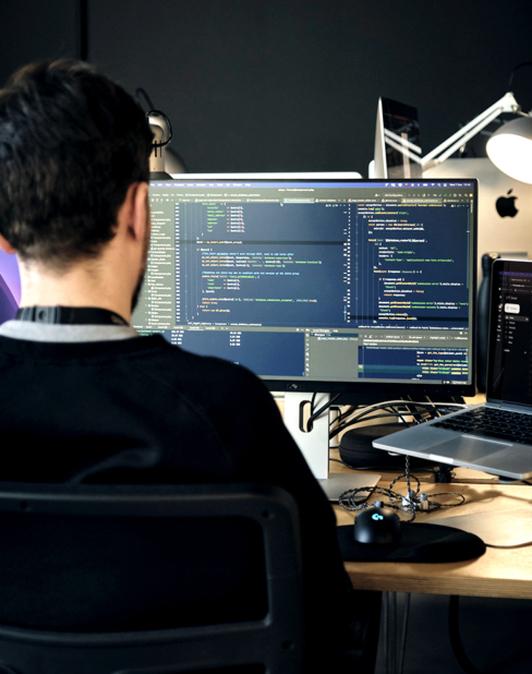 man working at computer coding